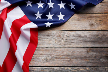 Fototapeta na wymiar American flag on grey wooden table