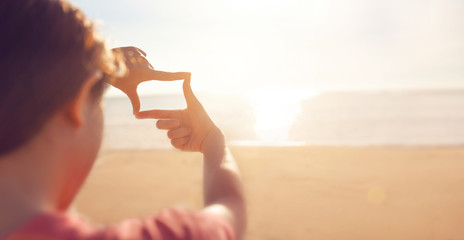 Future planning, Close up of woman hands making frame gesture with sunrise on sea summer, Female...