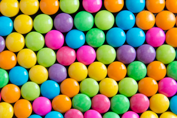 Pile of colorful sweet candy chocolates coated background. colourful collection