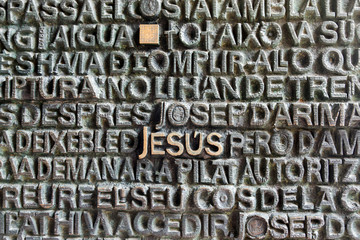 Barcelona, Spain - March 19, 2018: Jesus name written on the main door of the Passion facade of The Temple of the Sagrada Familia