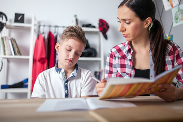 Stressed mother and son frustrated over failure homework, school problems concept