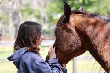 Profile of Girl Petting Horse Face