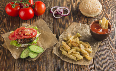 Delicious burgers with beef, tomato, cheese and lettuce