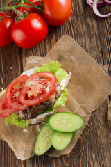 Delicious burgers with beef, tomato, cheese and lettuce