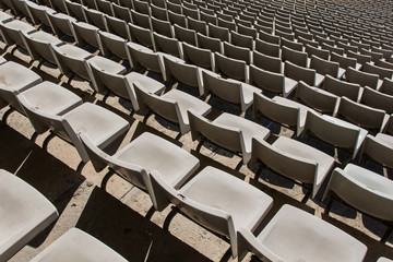 Fototapeta na wymiar Empty Stadium seats row in a sports stadium