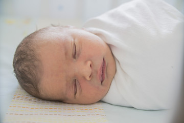 Fototapeta na wymiar close-up baby newborn infant lying in bed