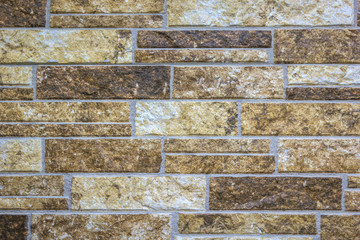 Old vintage multi colored (brown, beige, red) brick wall, grunge urban street background