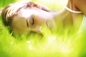woman sleep on grass