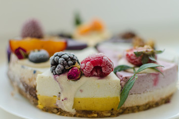 different pieces of cake on cake stand © Dmitri