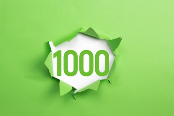 grüne Nummer 1000 auf grünem Papier - obrazy, fototapety, plakaty