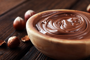 Homemade hazelnut spread in wooden bowl. Hazelnut Nougat cream