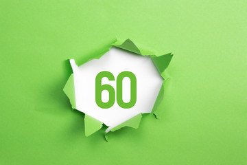 gruene Nummer 60 auf gruenem Papier