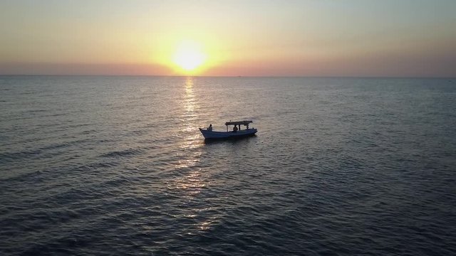 Sailing on a Fishing Boat at Sunset