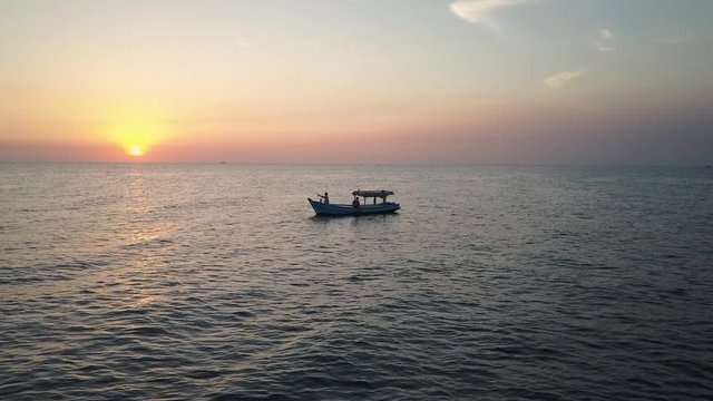 Fishermen Sailing on a Fishing Boat at Sunset 2
