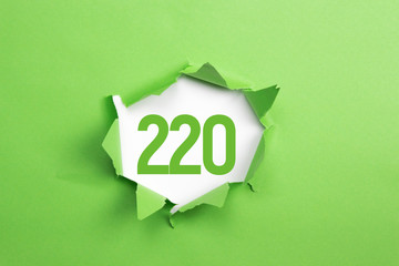 gruene Nummer 220 auf gruenem Papier