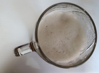 Obraz na płótnie Canvas beer froth in a glass