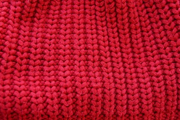 red texture of wool fabric on clothes made of sweaters
