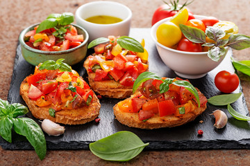 Italian bruschetta with chopped tomatoes and basil   on grilled crusty bread.