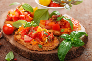 Italian bruschetta with chopped tomatoes and basil   on grilled crusty bread.