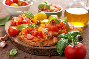 Italian bruschetta with chopped tomatoes and basil   on grilled crusty bread.