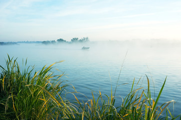morning fishing on a misty lake