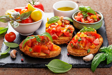 Italian bruschetta with chopped tomatoes and basil   on grilled crusty bread.