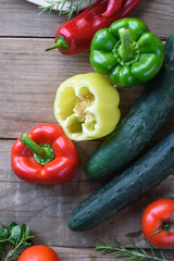 Selection of colorful vegetable on wooden table. Cooking fresh food background.