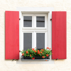 red wooden window exterior