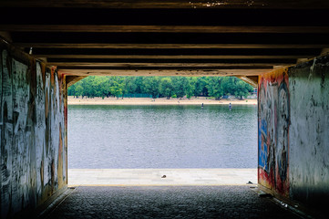 panoramic city landscape, view of the river from the underground passage, the concept of urban objects in nature. Kiev, Ukraine, copy space, closeup.