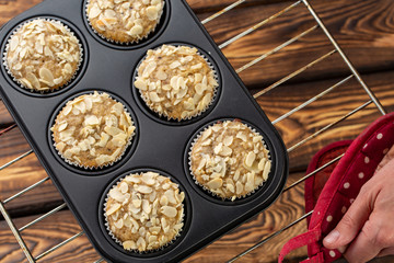 Homemade blueberry bran muffins with almond in bakeware