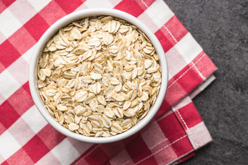 Dry rolled oatmeal in bowl