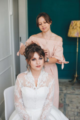 Make-up artist prepares the bride before the wedding. Make-up.