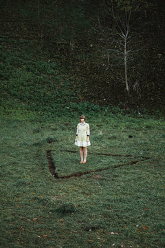 Young woman standing in a triangle