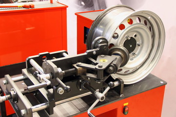 Equipment for car service and repair - tire machine for rolling and alignment of steel wheel rims