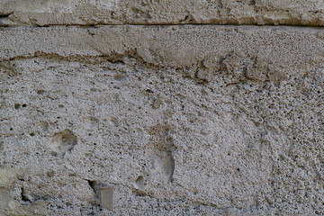 Background of gray concrete blocks of a wall texture