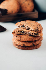 Chocolate cookies on white table. Chocolate chip cookies shot. Toned image.