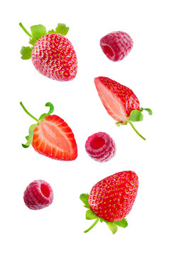 Fresh flying strawberries and raspberries isolated