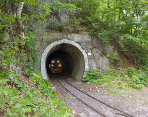 Fototapeta na wymiar Train in railway tunnel in Lillafured