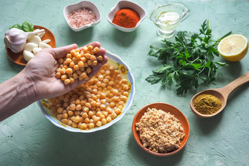 Ingredients for traditional hummus on the kitchen table. Top view.