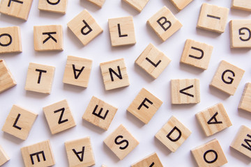 background of letterpress wood type printing blocks, random letters of alphabet and punctuation...