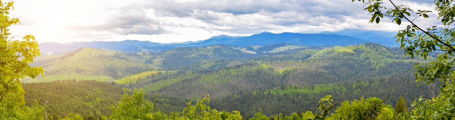 Obraz premium Mountain landscape - panorama. The sun is over the Carpathians. fantastic mountain scenery.