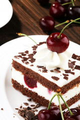 Chocolate cake with cherries and whipped cream. Black Forest cake