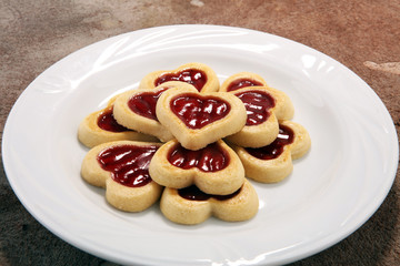 Obraz na płótnie Canvas Heart shaped Valentines Day cookies with jam. Shaped biscuit cookie