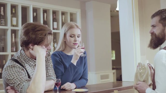 Couple in love. Handsome man flirting with cute woman in restaurant. Bearded man flirting with young sexy blonde
