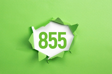 gruene Nummer 855 auf gruenem Papier