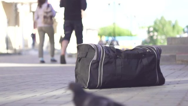 left bag on the street, terrorist attack close up slow mo