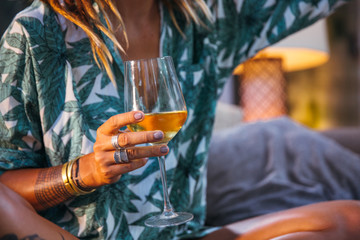 Woman drinking white wine at home