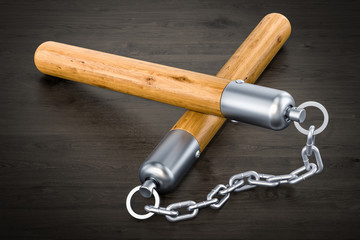 Nunchaku on the wooden table, 3D rendering © alexlmx