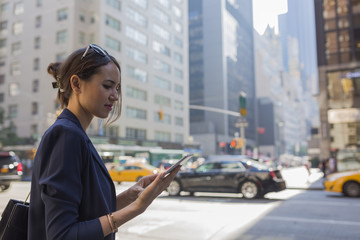 Young Businesswoman Working With a Digital Tablet in Manhattan ,