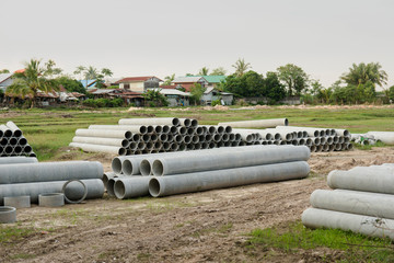 stacked of concrete, cement pipes. concrete pipes for irrigation at construction site